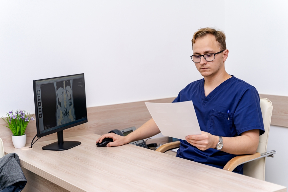 Doc,Reviewing,X ray,Results ,A,Medical,Professional,Studies,X ray,Images